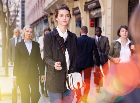 Young woman walking on street