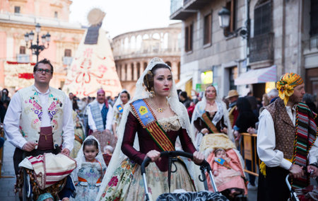 People in national costumes walking through streets