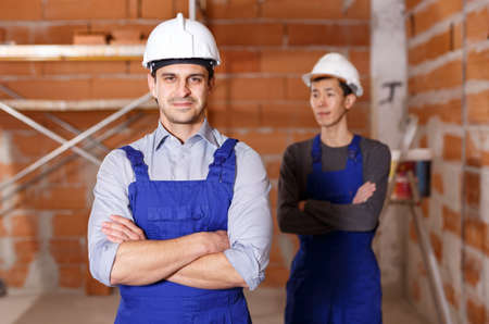 Portrait of two confident workersの写真素材