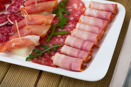 Spanish sausage sliced - chorizo, fuet, jamon, salami, baconの写真素材