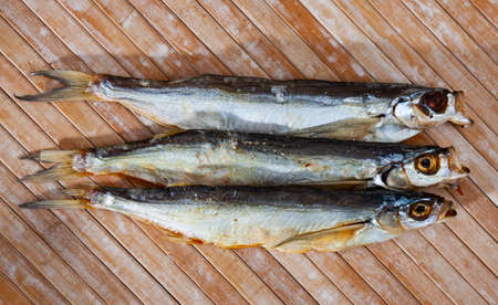 Image of air-dried salted sabrefish on wooden backgroundの写真素材