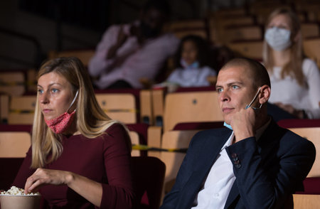 People watching a family movie at cinema