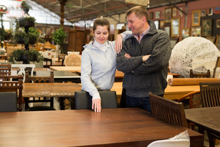 Couple chooses table in furniture storeの写真素材