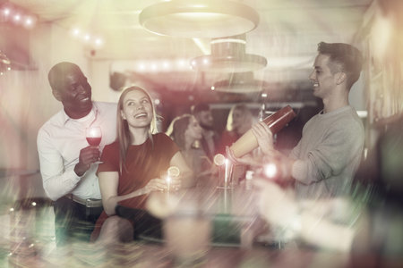 Couple are drinking cocktails and having fun in the nightclub