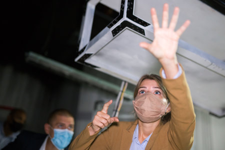 Young woman solving puzzles in quest roomの写真素材