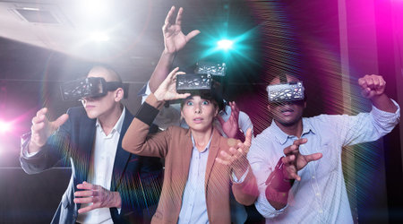 People using virtual reality headset and gesturing