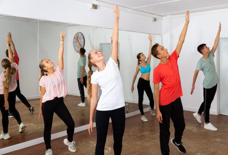 Teenage dancers practicing in dance studio