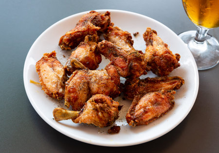 Delicious pan-fried chicken wings with crispy crustの写真素材