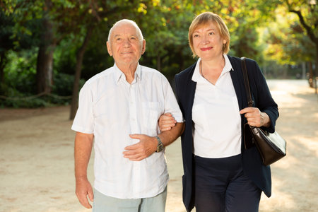 Elderly couple enjoying walk in park