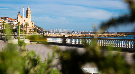 Sitges embankment overlooking beach and Church, Catalonia, Spainの写真素材