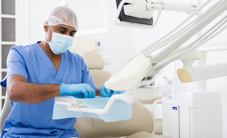 Dentist preparing special medical tools in dental officeの写真素材