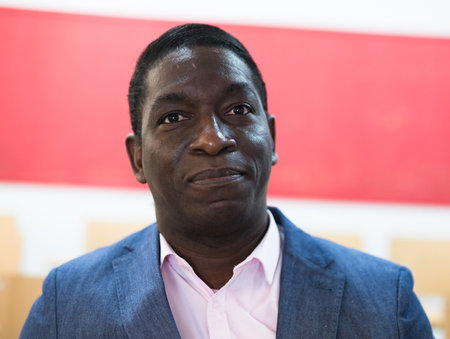 Head shot close up adult calm african american man in interiorの写真素材