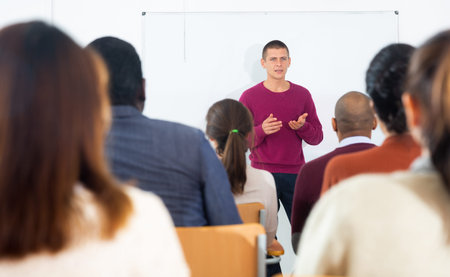 Teacher at the slate explains the lesson to student