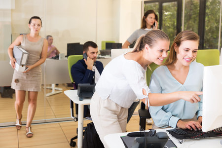 business woman explaining something to female coworker