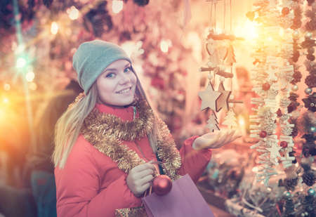 Woman shopping on Christmas marketの写真素材