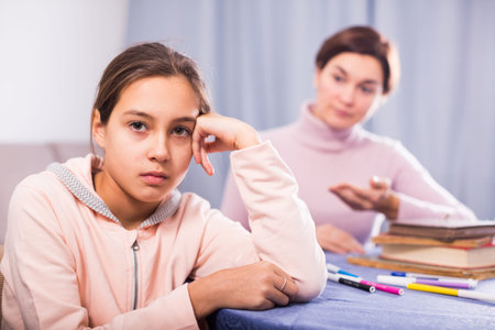 Mother seriously talks to daughter