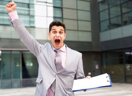 Businessman outdoor celebrating successの写真素材