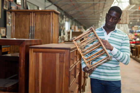Man choosing furniture in furnishing salonの写真素材