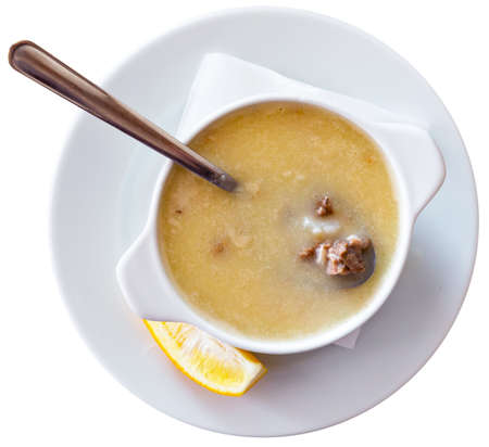 Turkish soup Paca corbasi served with lemon sliceの写真素材