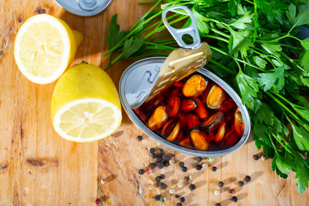 Marinated mussels in oil with lemon and greensの写真素材