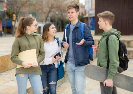 Teenage students talking outside after lessons