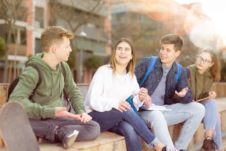 Group of positive teenagers having fun togetherの写真素材