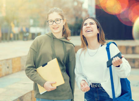 Two smiling teenager girls friendsの写真素材