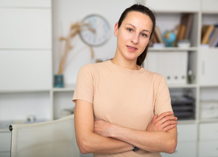 Portrait of smiling girl standing in officeの写真素材