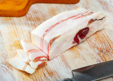 Appetizer salted pork bacon at wooden background, nobodyの写真素材