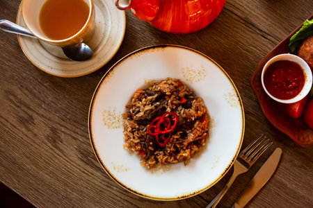 Uzbek pilaf with rice, meat, carrots and onions