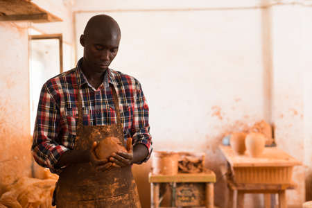 Craftsman moulding wet clayの写真素材