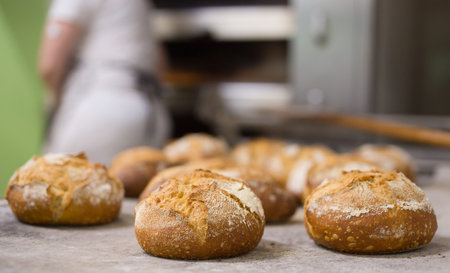Fresh hot bread on table in bakery