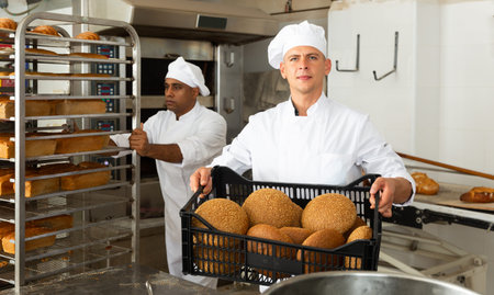 Portrait of baker with fresh bread at bakery