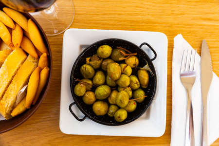 Marinated olives with pits - Spanish tapasの写真素材