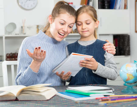 Woman helping her daughterの写真素材