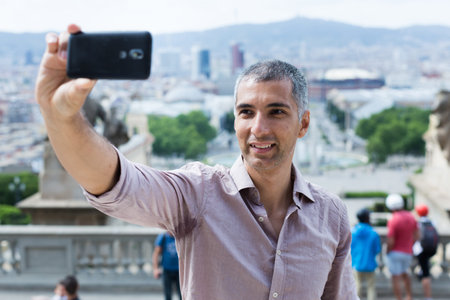 Man is taking photo by phone after excursion