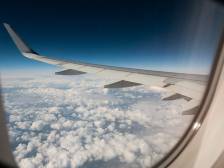 Airplane wing. view from the airplanes portholeの写真素材
