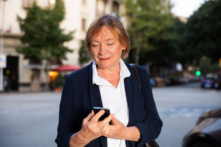Senior woman using her smartphoneの写真素材