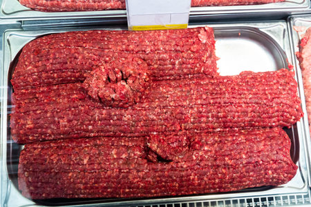 Fresh raw minced pork and beef at the grocery store counter