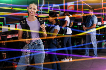 people looking laser guns and clothes togetherの写真素材