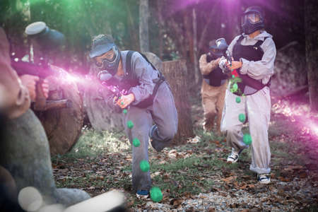 Teams playing paintball outdoorsの写真素材