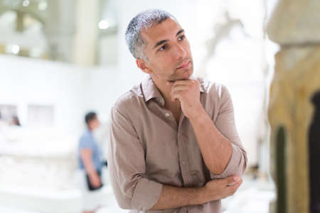 Man is looking at the expositionの写真素材