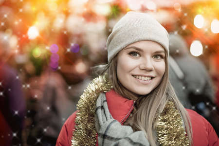Woman posing on Christmas marketの写真素材