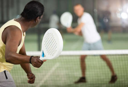 African american man playing paddle tennisの写真素材