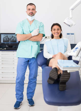 Portrait of positive dentist and happy cute womanの写真素材