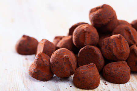 Chocolate candies truffles on light tableの写真素材