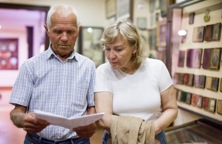 Man and woman with guidebook at Museum