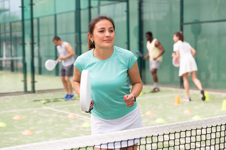 Two sports women playing padel on tennis courtの写真素材