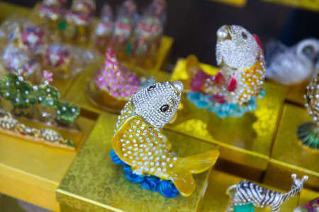 Colorful figurines decorated with crystals on showcase of Tbilisi gift shopの写真素材