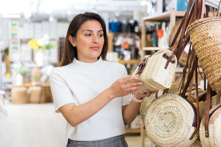 Female buyer straw bag at hardware storeの写真素材